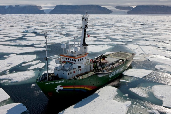 The Greenpeace ship MY Arctic sunrise pictured in cracked and drifting ice in front of the Petermann glacier (out of shot to the left) This is the zone where the glacier's front meets the sea and starts to break up. This is the furthest point that the ship can get to the front of the glacier to begin research via helicopter, inflatable and perhaps by foot/ skis. Greenpeace and leading climate scientists are in Greenland for a 3 month expedition using their icebreaking ship the Arctic Sunrise to gather climate change data for the Copenhagen climate summit in December 2009.